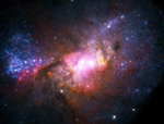 Esta foto-ilustración de la Nasa nos muestra estrellas en formación en el polvo estelar de una galaxia enana roja.